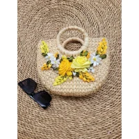 Handmade rattan handbag with embossed gold flowers