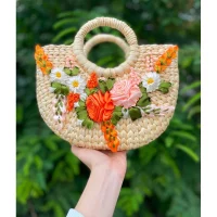 Handmade rattan handbag with embossed pink orange flowers