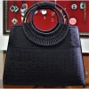 Elegant Black Woven Handbag with Round Handles